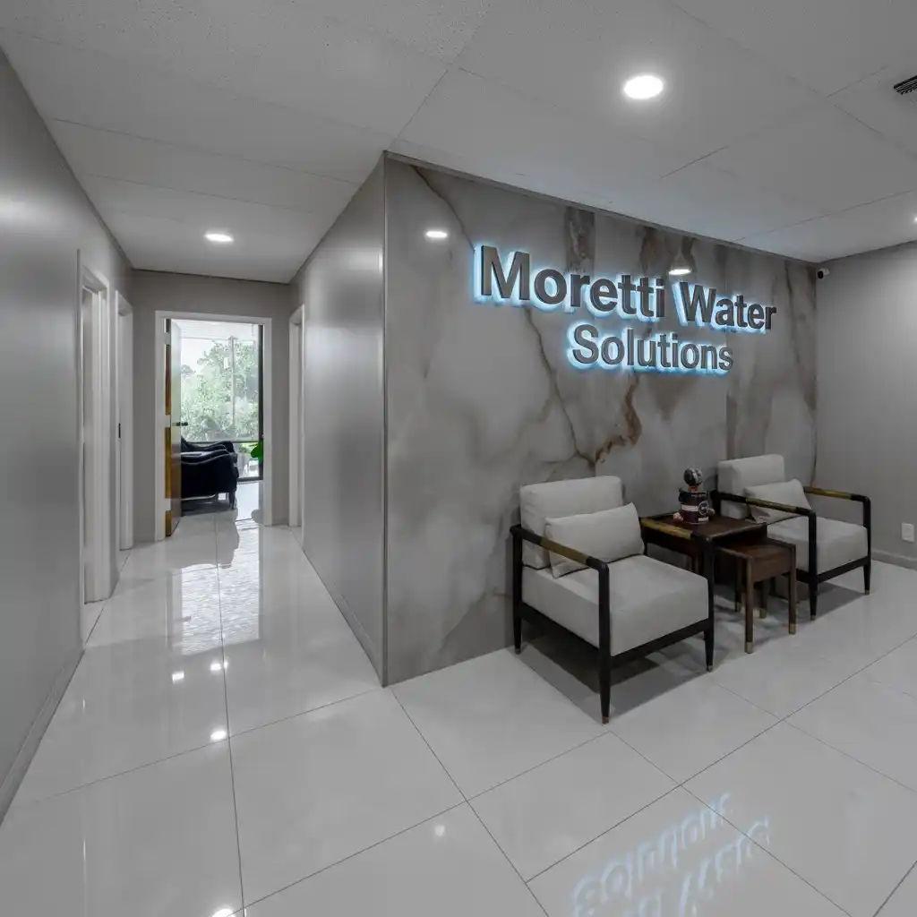 Interior reception at Moretti Water Solutions office with logo on wall
